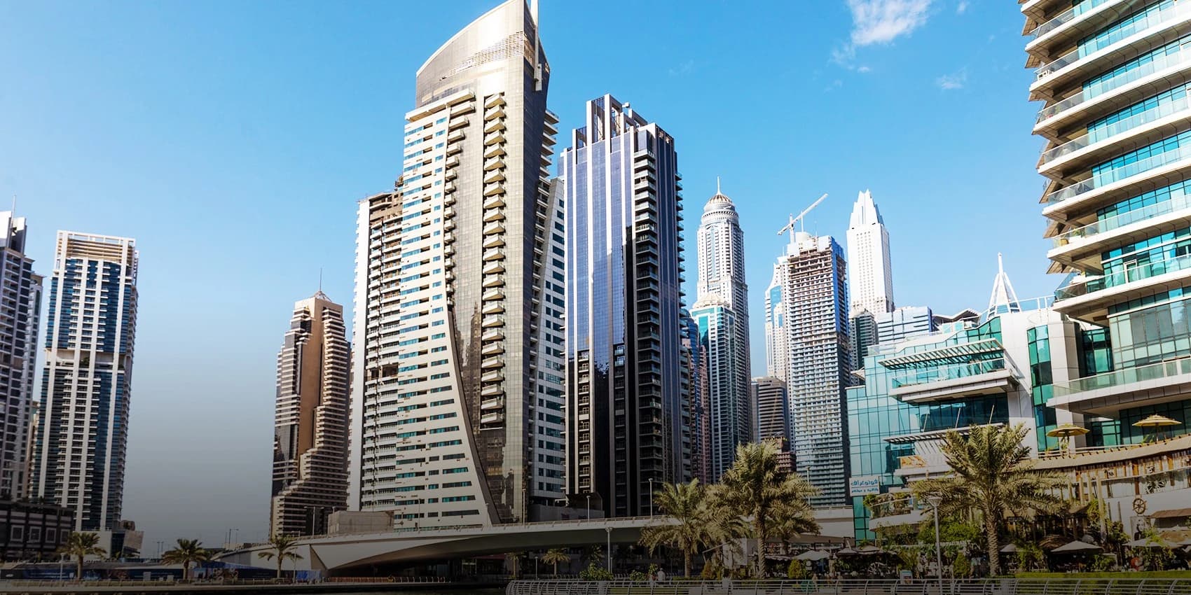 Financial documents and calculator showing property selling fees and cost breakdown in Dubai