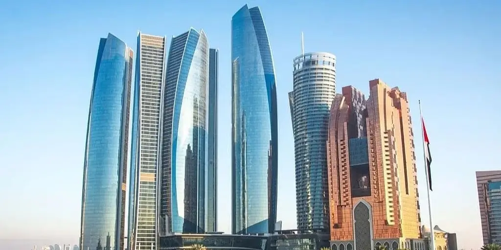 Abu Dhabi DMT building with regulatory documents and digital interface