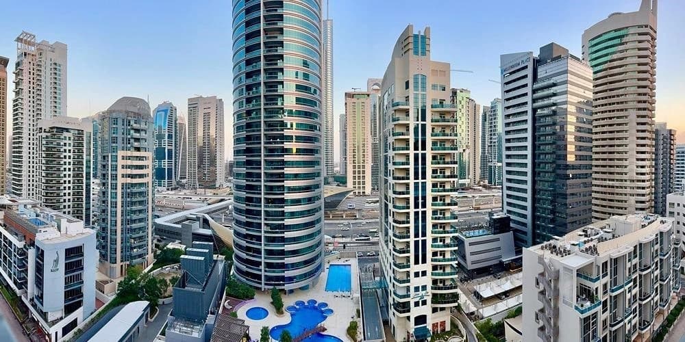 Legal documents and Dubai skyline representing real estate laws and regulations framework