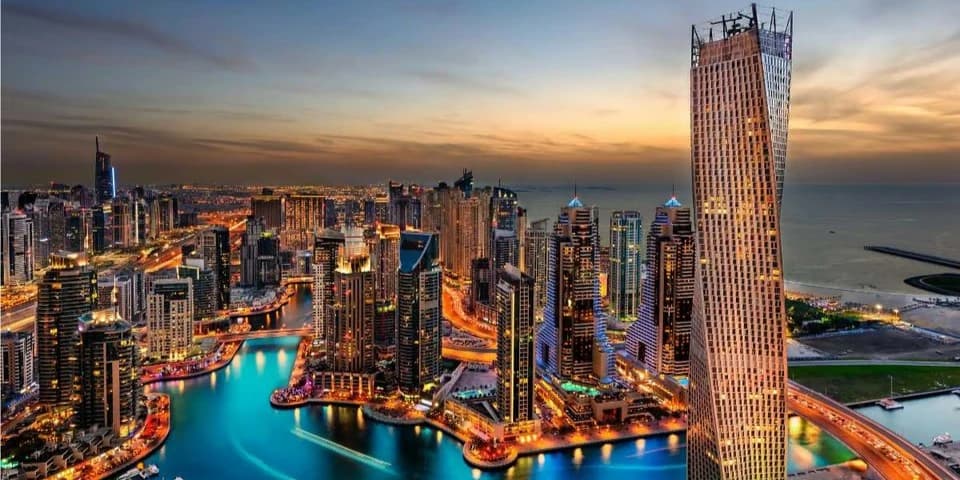Dubai skyline with market charts showing real estate sales growth and transaction data for February 2026